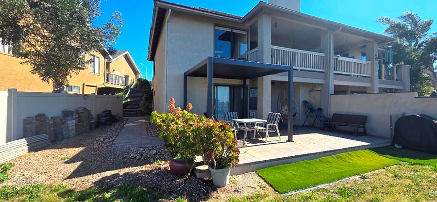 Your home is on the lower level, follow the stairs down to your private back yard