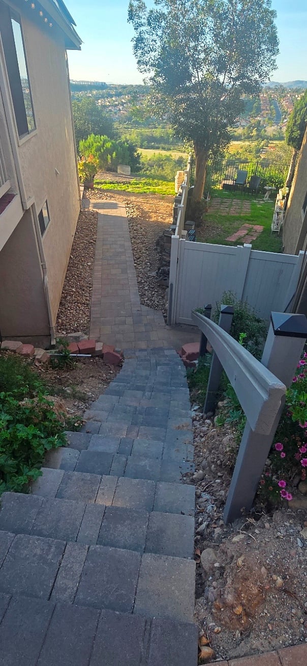 Stairs leading down to entrance and backyard and canyon