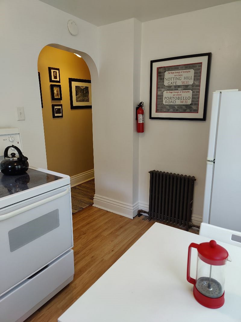 Full kitchen with. an electric range and full size apartment fridge