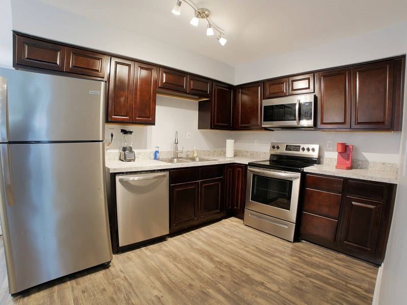 Full feature kitchen with an electric stove, microwave, keurig coffee maker, and a blender. A full size fridge with top freezer and a dishwasher are available for use. Cookware, dishes, cups, glasses, and utensils to comfortably serve 4 people are also provided for your stay.