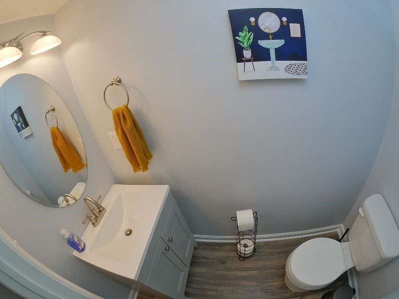 Half bathroom conveniently located in the first level.