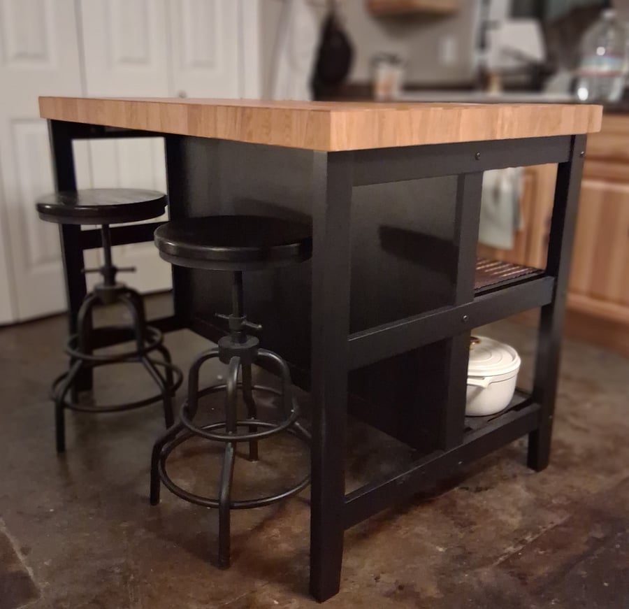 You have the option of using the white table and chairs pictured or this new butcher block island with storage and stools.