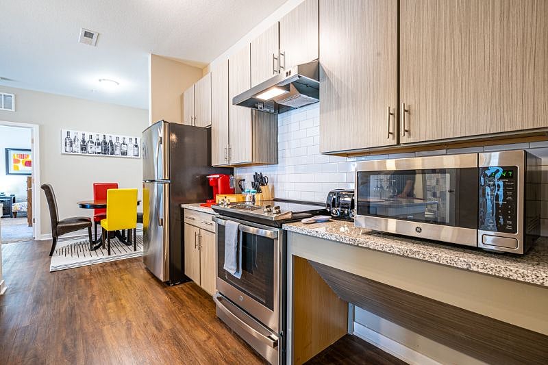 Stainless steel appliances welcome your culinary skills and delights.  Space below counters allows movement and better cabinet accessibility for wheelchairs.