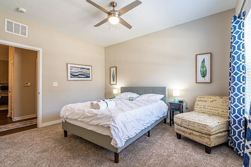 Guest Bedroom. The queen-size bed is extremely comfortable with a 12-inch foam mattress and duvet cover. Black-Out curtains help keep the room dark when preferred. Plenty of dresser and closet space to fold and store your suitcase and clothes
