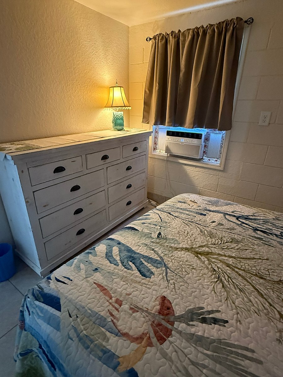Bedroom with lots of storage and window AC