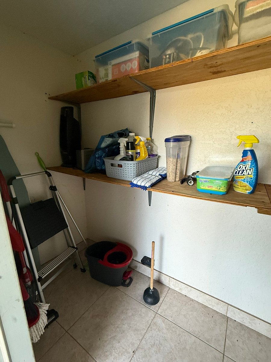Outdoor storage area with cleaning supplies, chairs and other items for you to use.