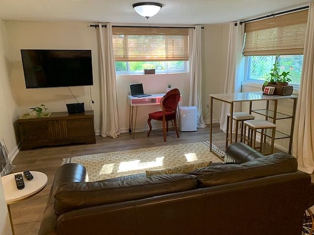 New blinds and black-out curtains on windows.