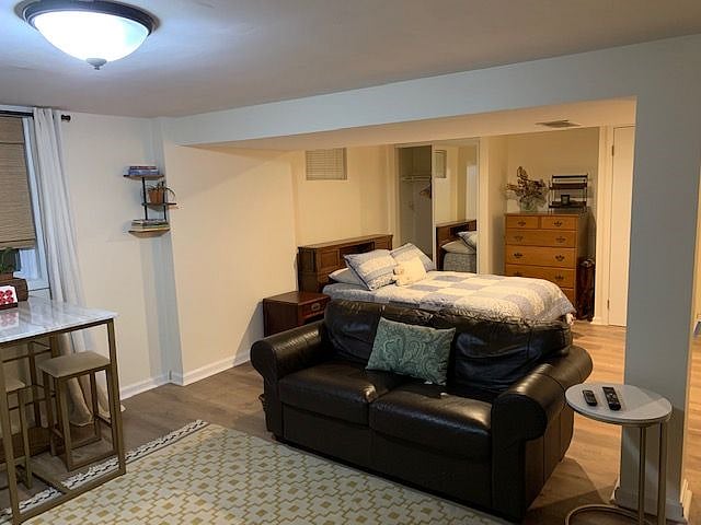 Full dresser tucked into wall to maximize space.