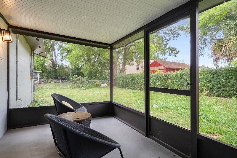 Enclosed patio looking out onto fully fenced backyard