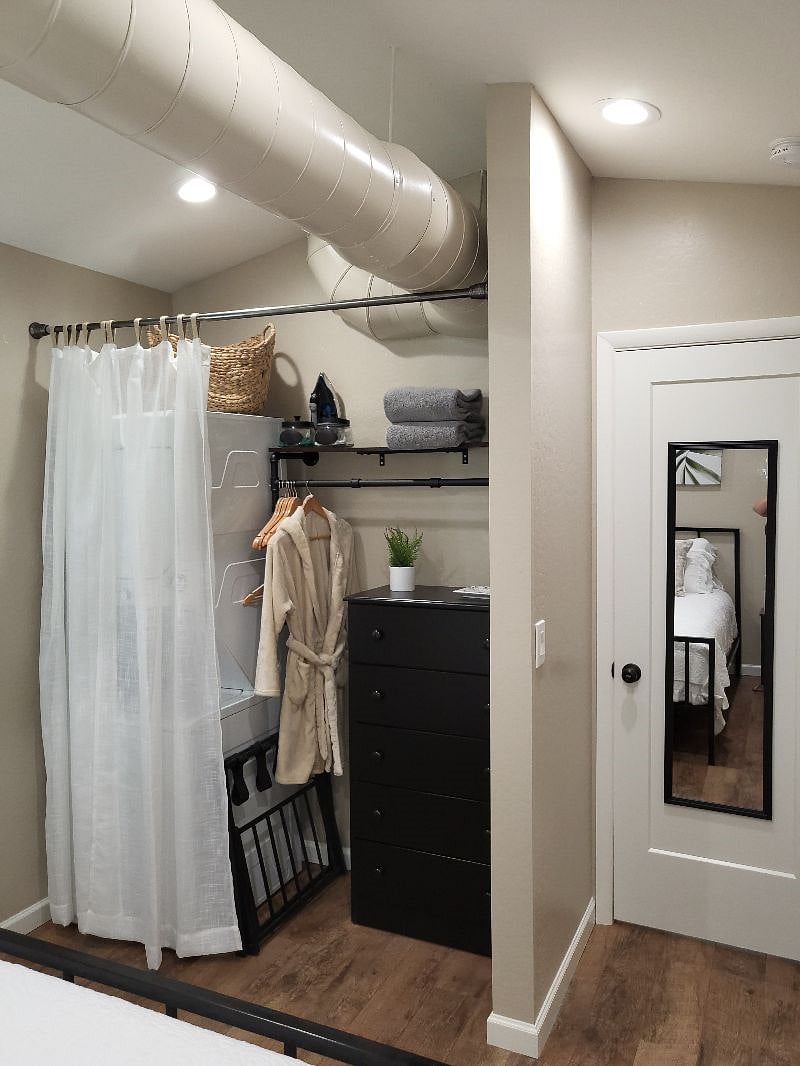 Stackable washer and dryer, extra hangers, dresser and extra towles