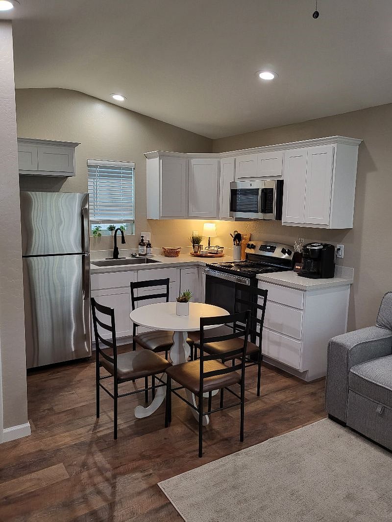  Stainless steel refrigerator, microwave and stove, farmhouse sink