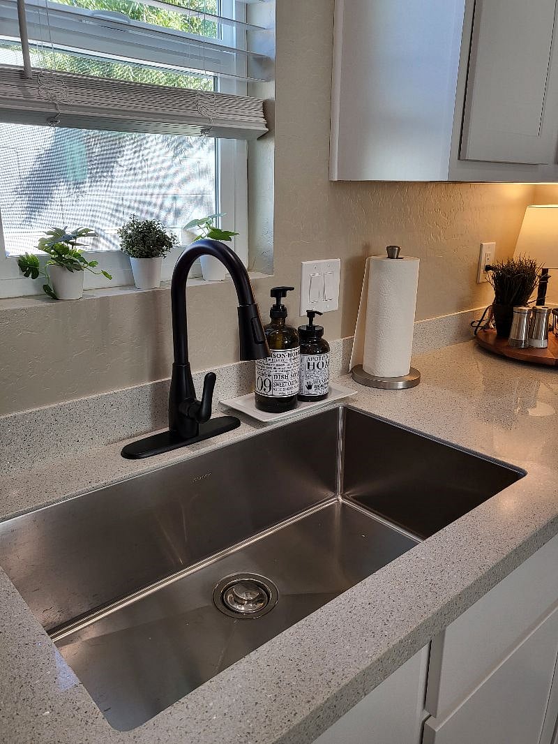 Farmhouse sink with drying rack, hand soap and dish soap