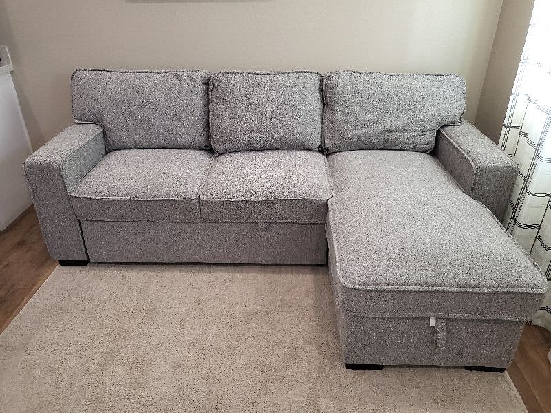 Sofa bed, gray color with extra sheet, linens and pillows