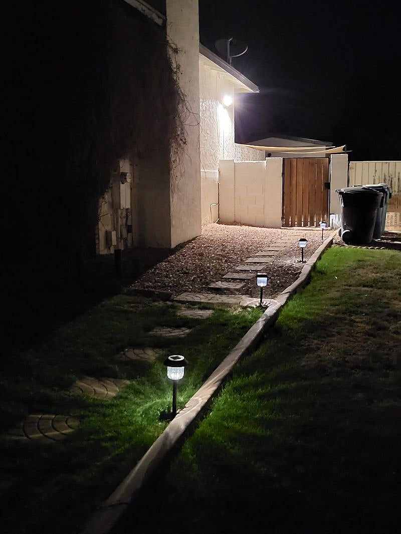 Walk way with solar lights to the house.