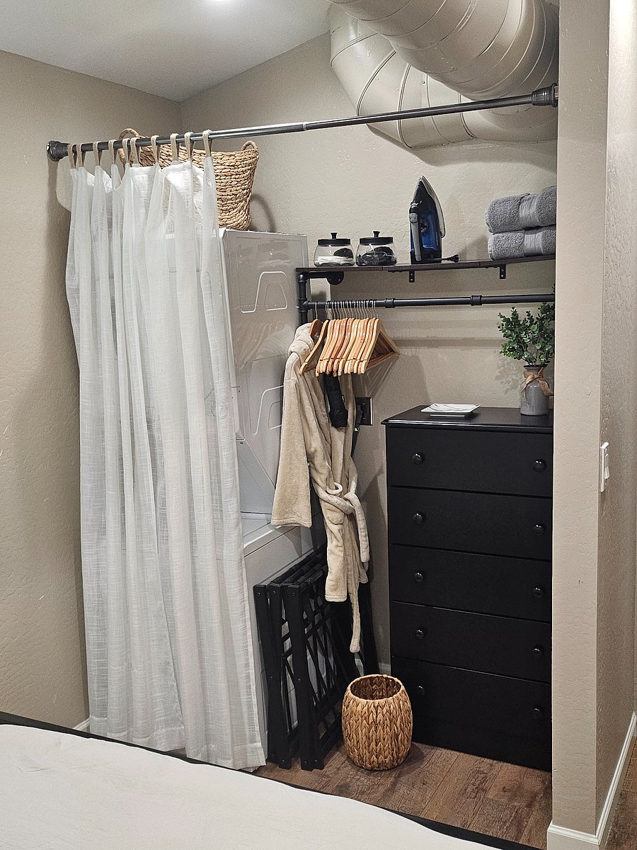 Washer/dryer, hangers, ironing board, iron, laundry soap and fabric sheets, spare towels and a dresser