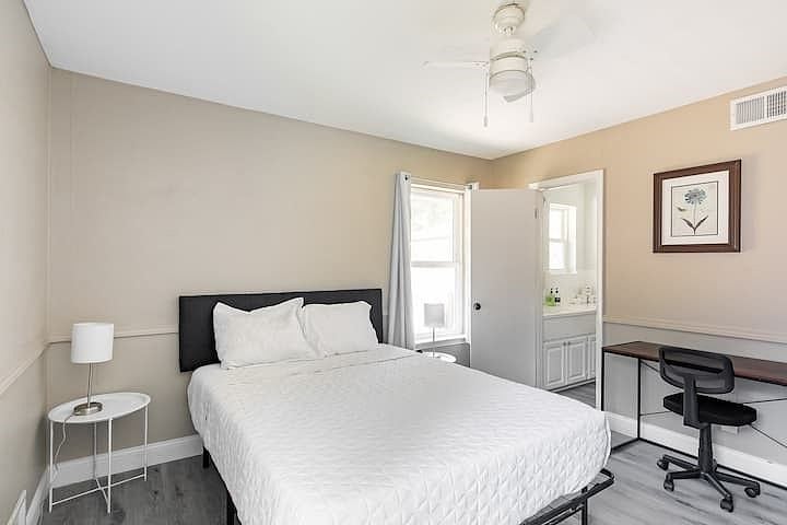 Queen Bed #2 with desk and chair, en-suite shared bathroom