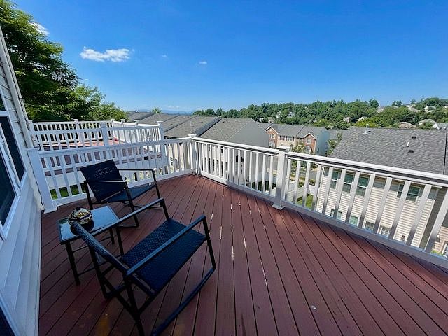 Enjoy the fresh air on Pantops Mountain with the breezy and spacious back deck!