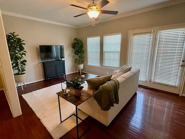 The cozy main floor den with access to the back deck.