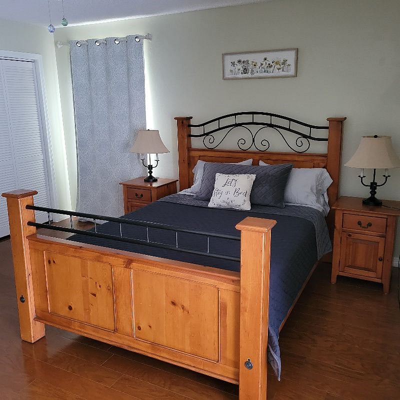 Master bedroom with queen sized bed, bonus area and attached master bath.
