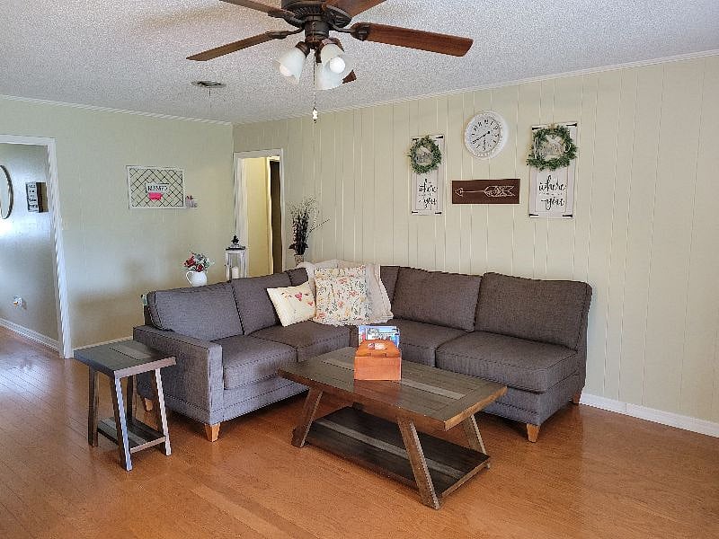 Family room with couch, coffee table, end table and smart tv connected to the internet.