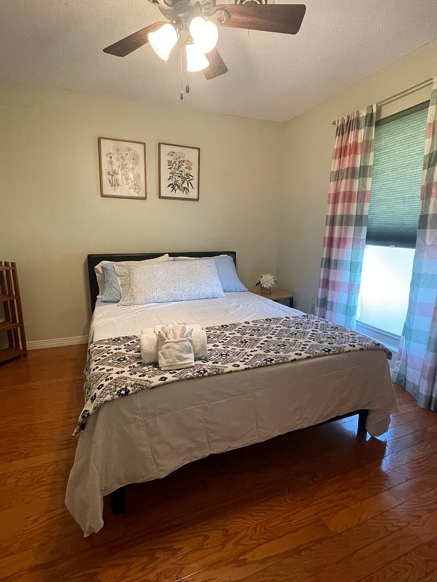 Bedroom 1 with drawer cabinet and end table.