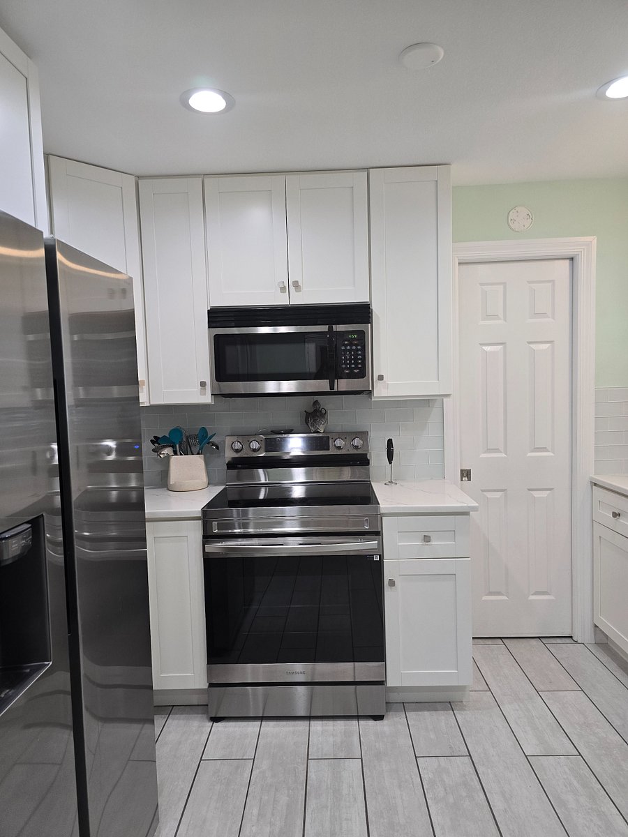 Kitchen, door to 1/2 bath and laundry room
m