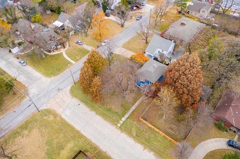 Home located on large corner lot with trees