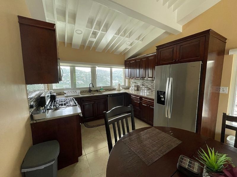 View of the valley from fully stocked kitchen with stainless steel appliances