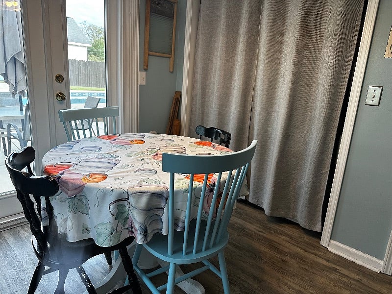 This table and chairs in the kitchen is a great place to eat too. It overlooks the pool on this side.