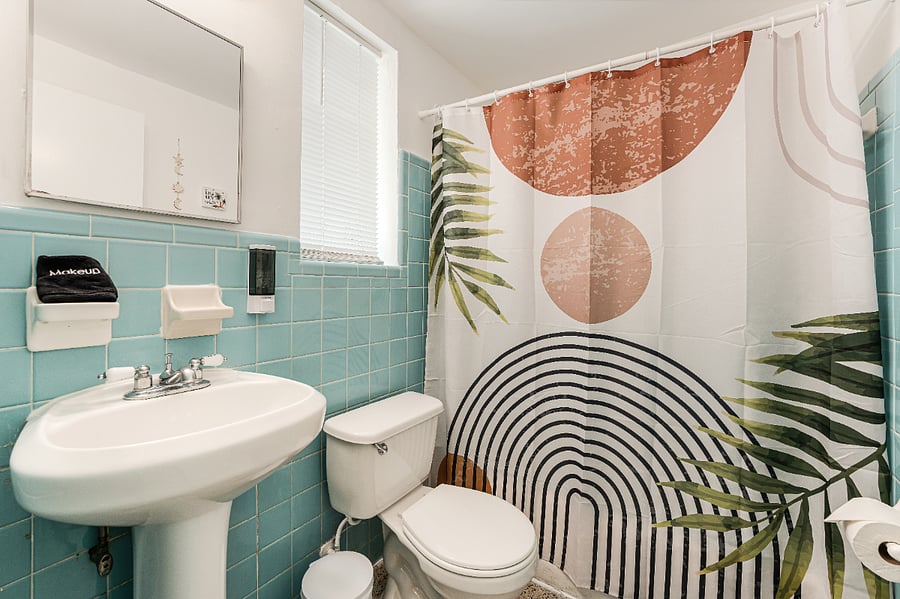 Full bath with shower, fresh linens, and thoughtful details