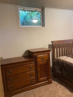 Bedroom with full size bed and dresser.