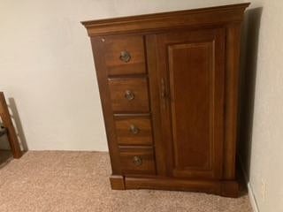 Armoire in second bedroom with daybed & desk.