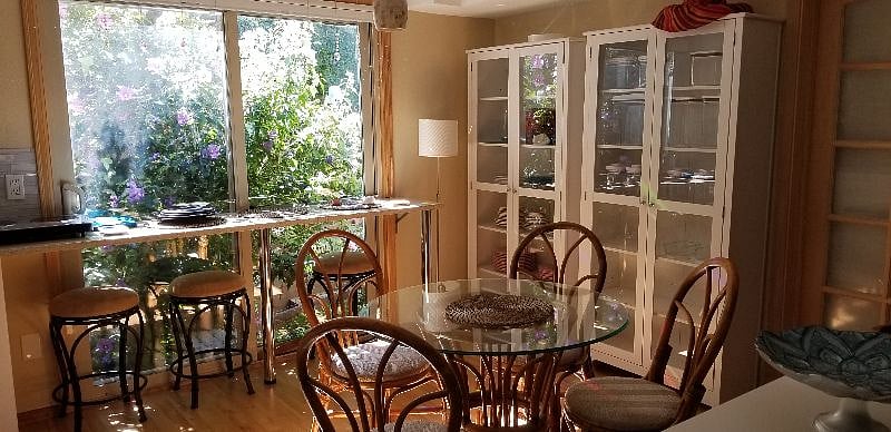 Dining area, plus kitchen pantry with storage containers
