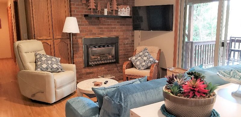 Living room with 43" Roku TV, gas fireplace, and comfortable seating