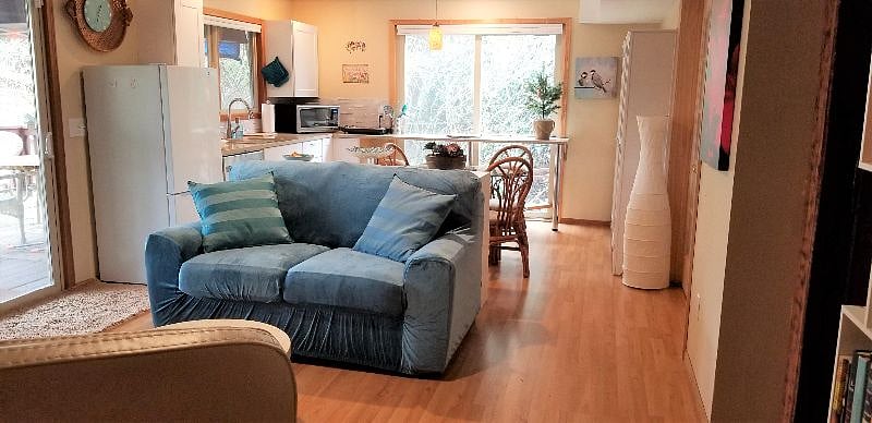 Comfortable sofa facing gas fireplace and 43" smart TV