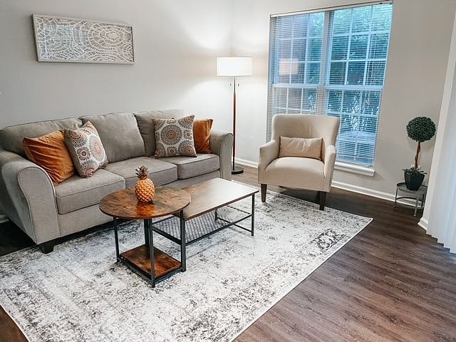 Living room area, with coat closet & utility closet. 