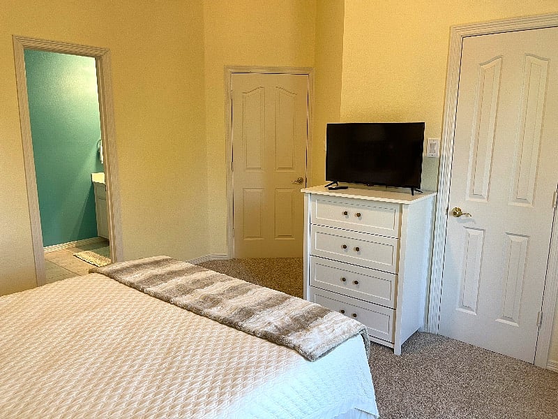 Smart TV, WIFI, dresser, empty closet with plenty of hangers, tv tray and laundry basket.