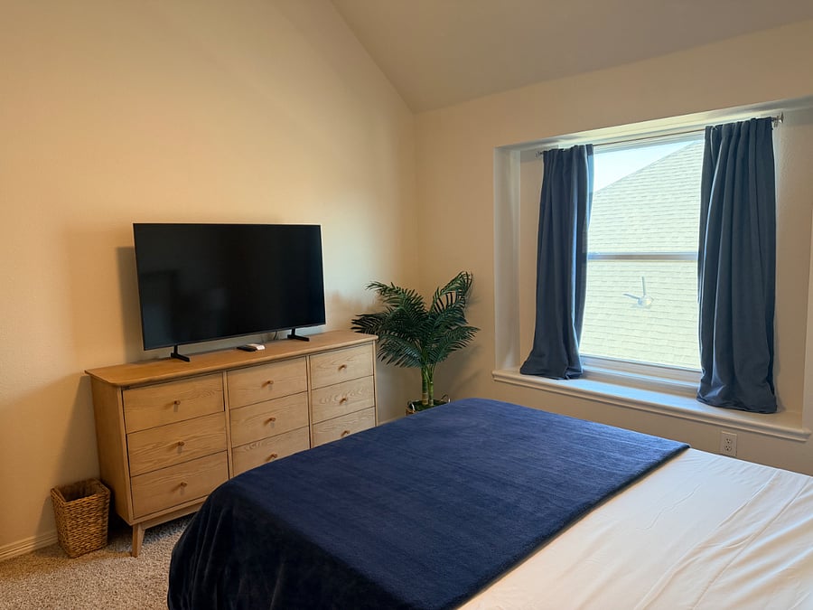 Smart TV, remote light/fan and blackout drapes. 