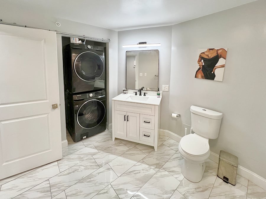 View from shower: washer and dryer.