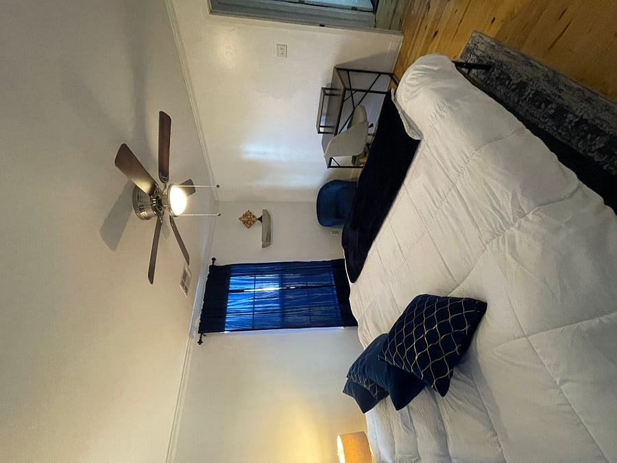 Main bedroom with desk and smart TV