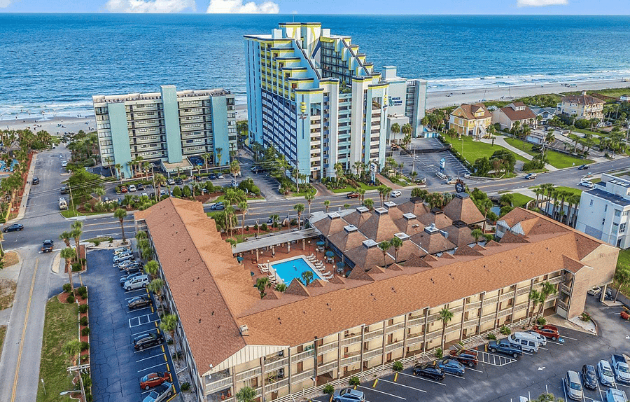 Condo is located just in front of the red car in the bottom right of the photo. Very easy parking!