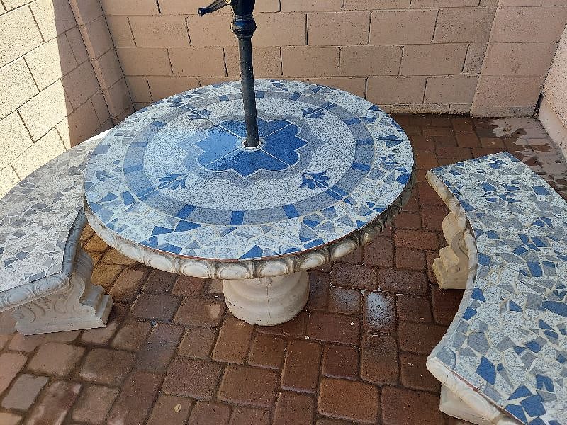 Cement patio table and benches and shade umbrella