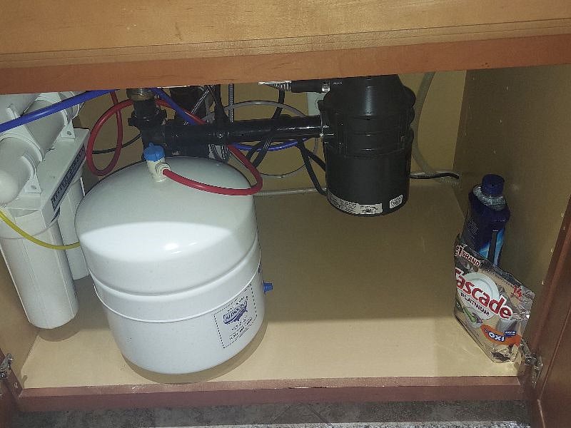 Under the kitchen sink. 