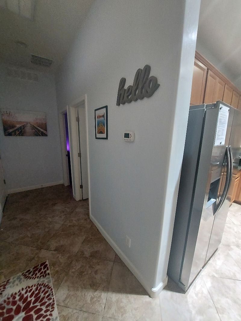Small hallway from front door to bathroom and bedroom.