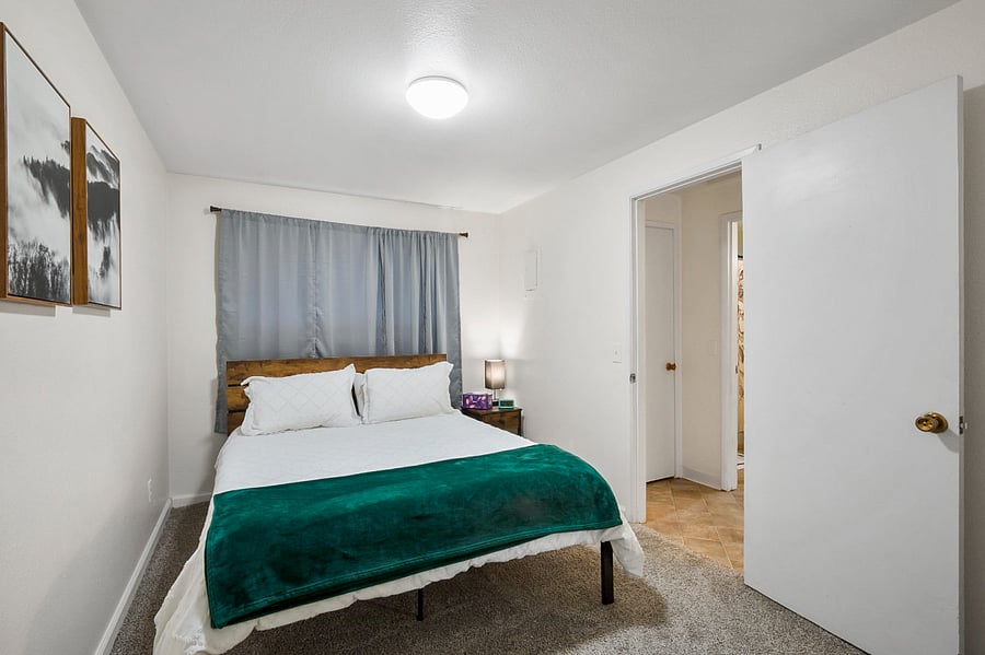 Queen size bed and side table.