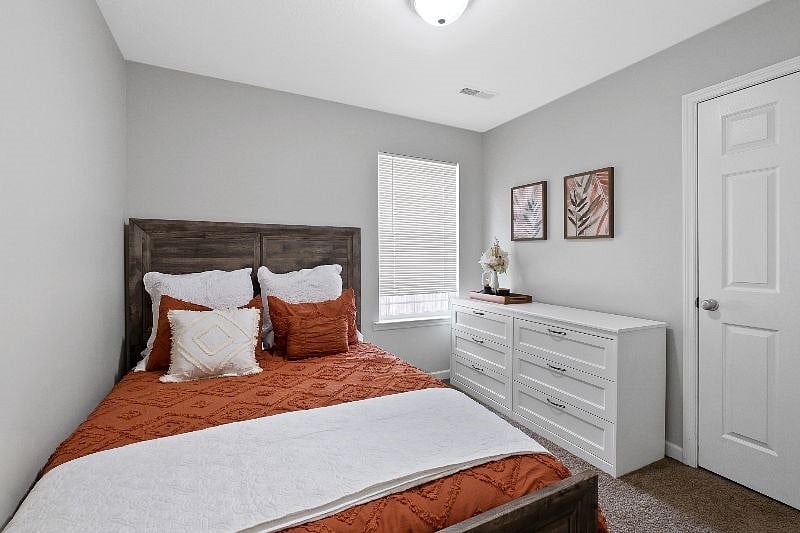 Queen size bed and full size dresser provide ample space for you to relax and store your things after exploring Chattanooga