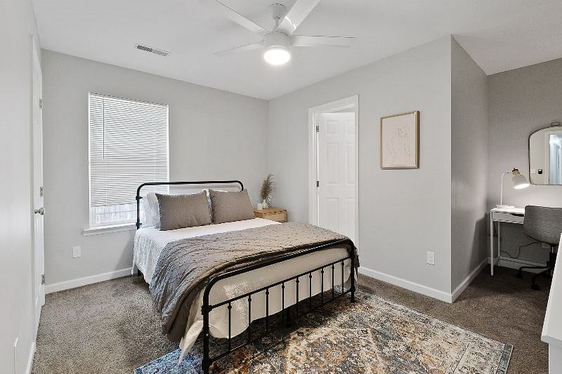Serene primary suite with desk/vanity space, queen size bed, SmartTV and full bathroom