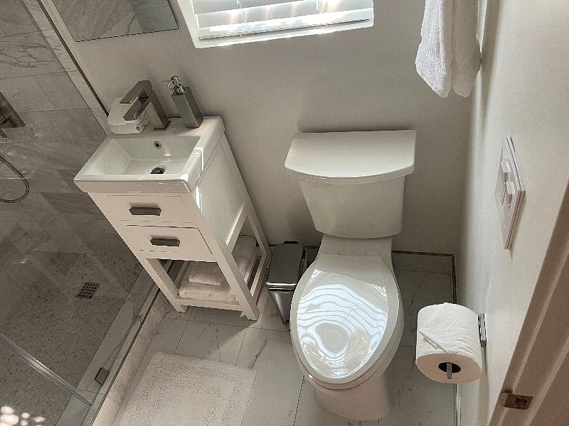 Spa inspired bathroom with tiled shower. Brand new!