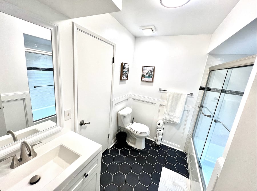 Master bathroom is connected to the master bedroom and hallway. This remodeled restroom has a bathtub!