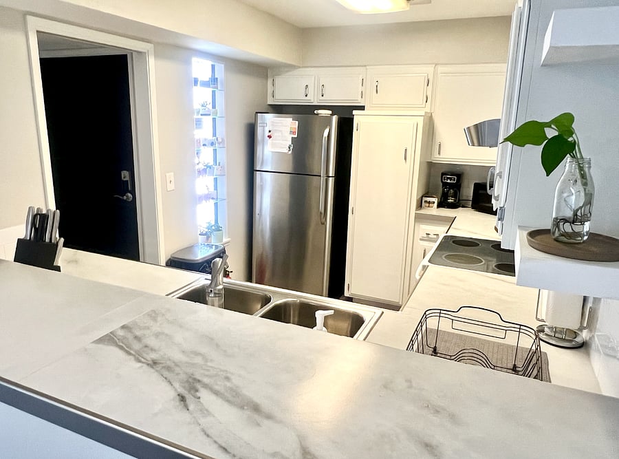 The kitchen comes equipped with a stove, oven, and new: microwave, coffe-maker, dishwasher, and refrigerator!